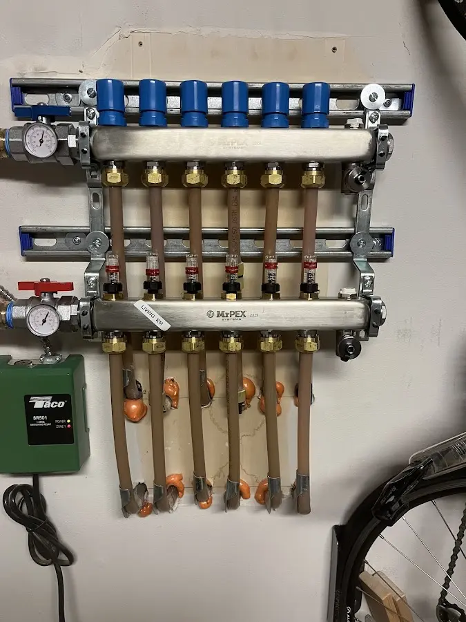 Plumber performing Water Heater Repair at a residential property in Durham